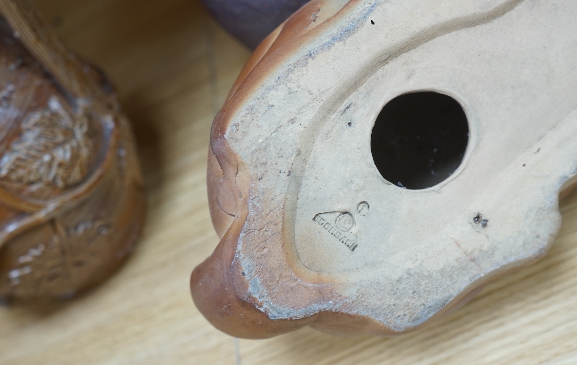 A collection of Studio pottery to include teapots and jugs, together with a pottery model of a rabbit, indistinctly signed to the base, and a French salt glazed wine jug, largest 33cm high. Condition - fair to good